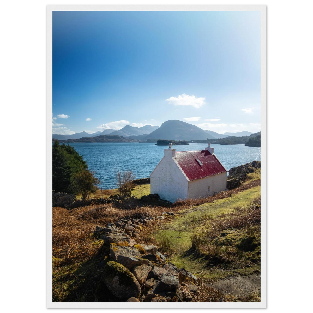 Red-roofed cottage on the rugged Applecross coast in
Scotland
